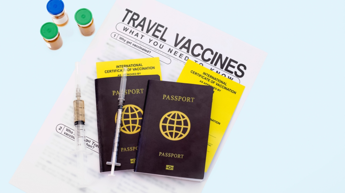 Travel vaccines brochures and passports on a table, highlighting a guide for parents on vaccines for children before international travel.